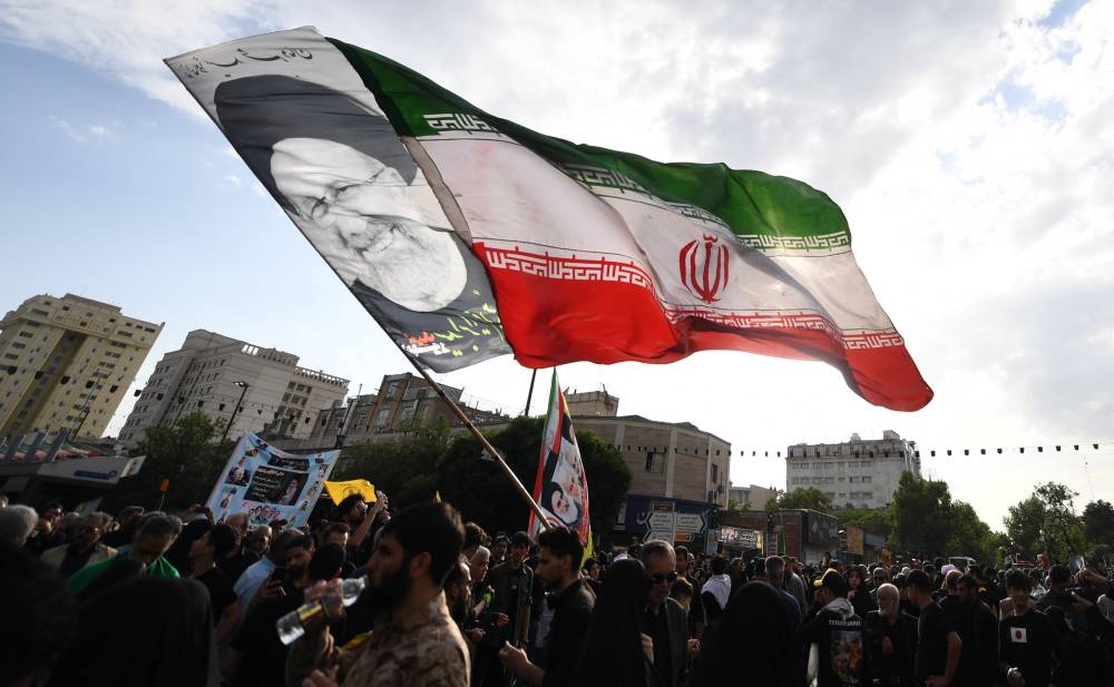 Iran Mourns as Late President Laid to Rest in Mashhad Shrine